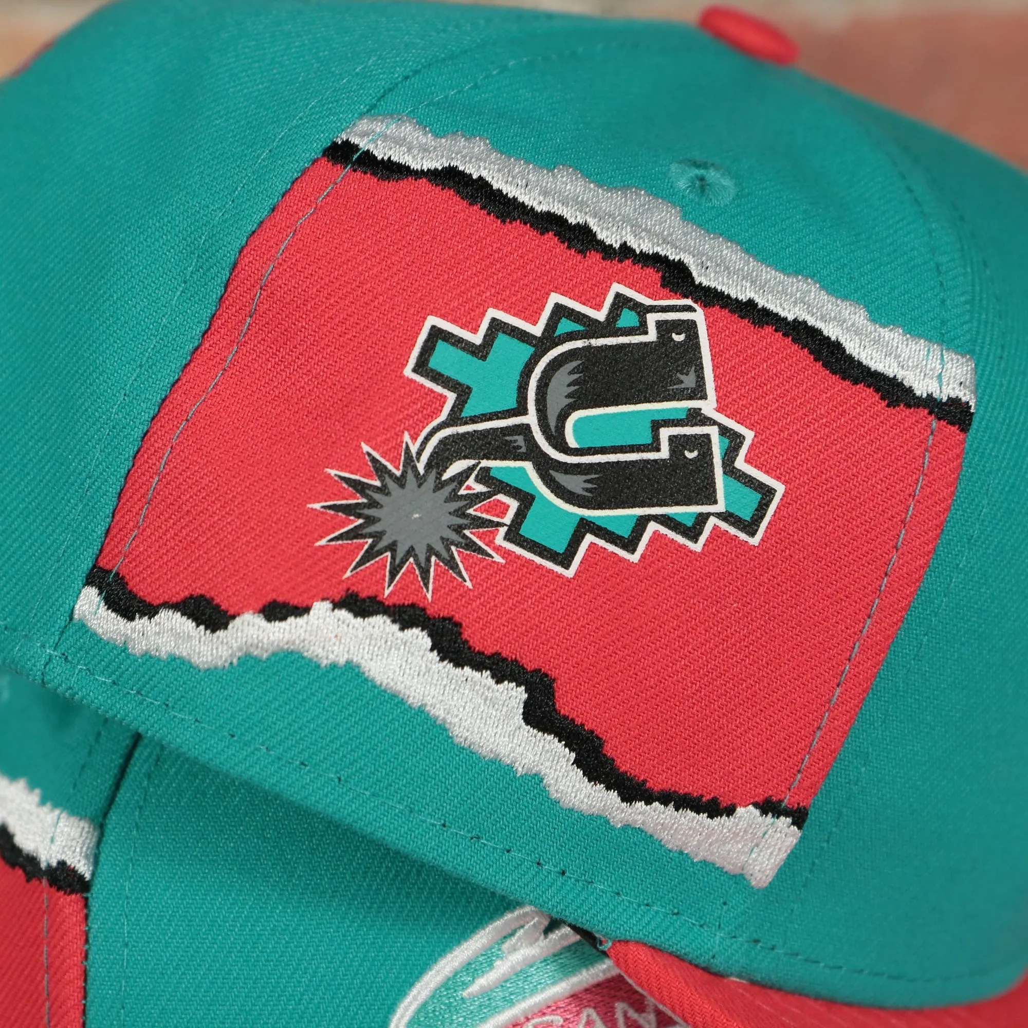 San Antonio Spurs Hardwood Classics Jumbotron Spurs Ripped Logo side patch Grey Bottom Teal/Red Snapback hat | Mitchell and Ness